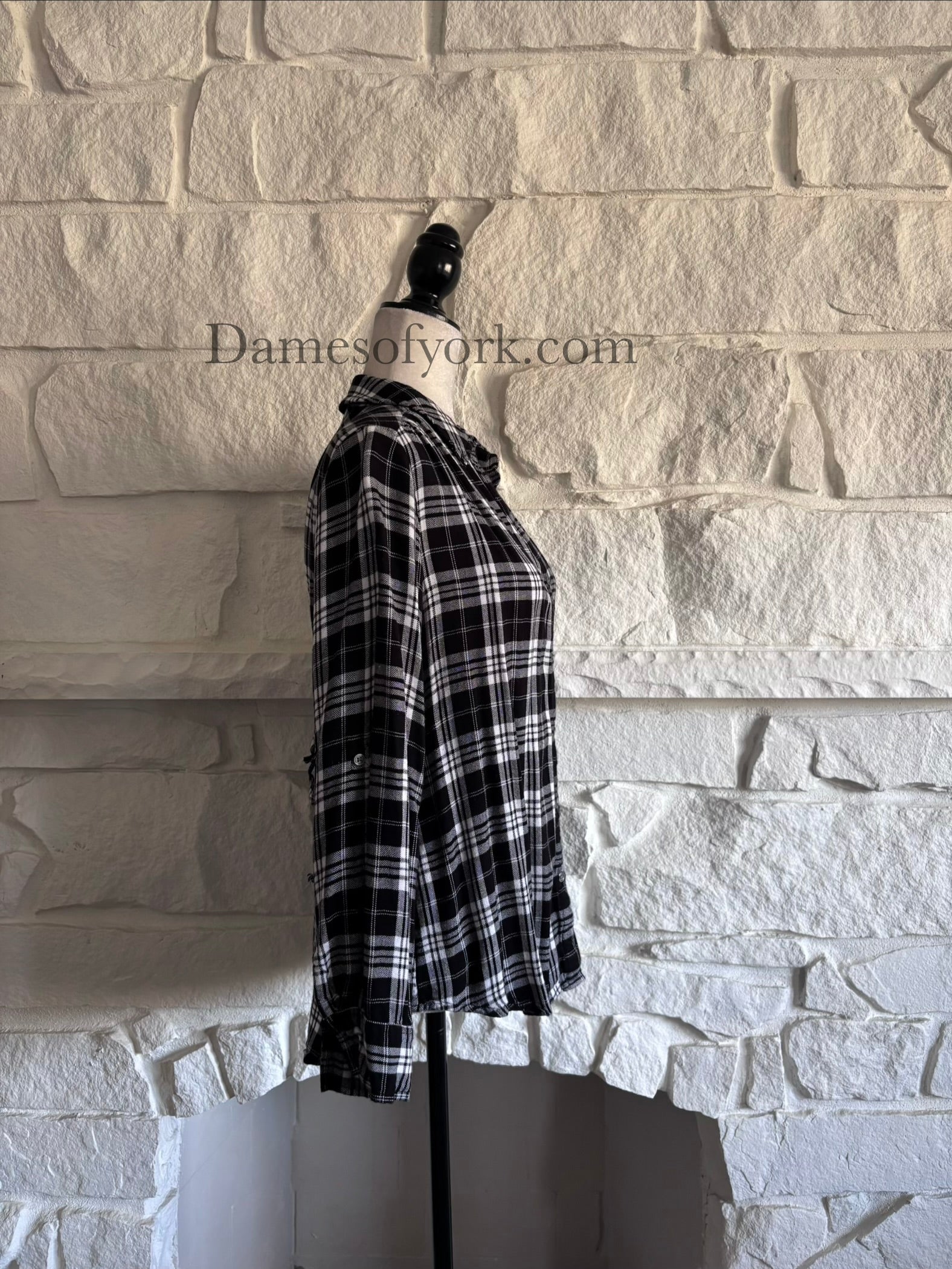 Side view of black and white plaid shirt with casual fit