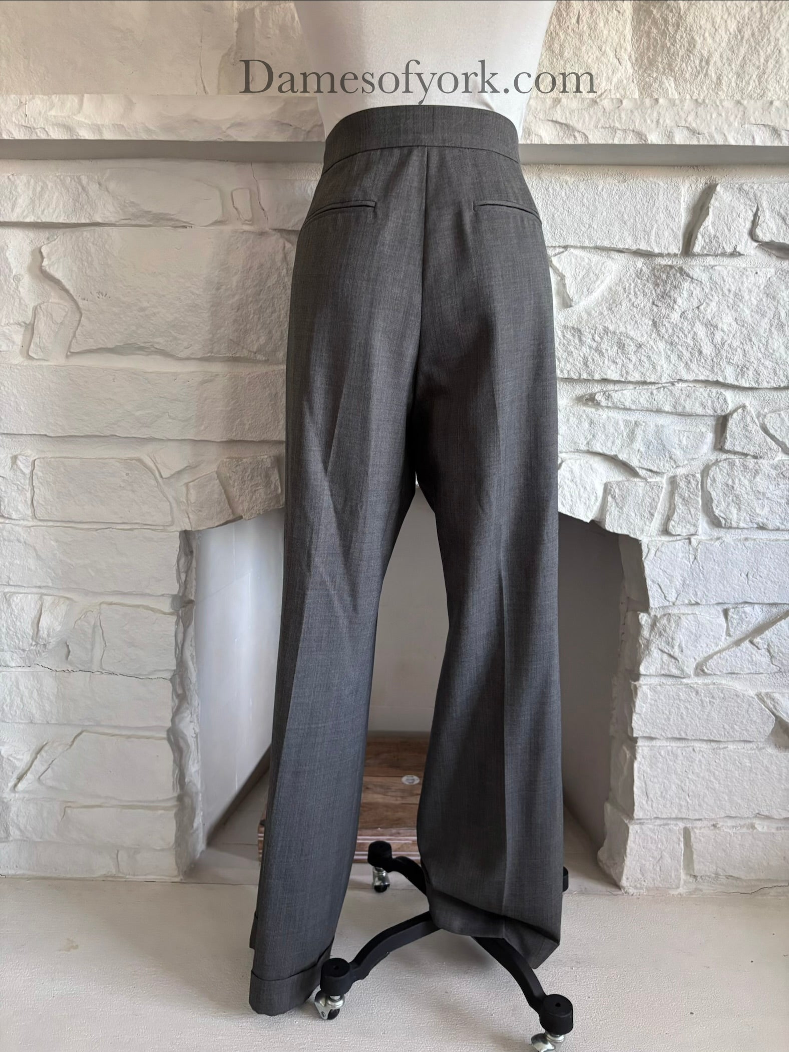 Back view of grey straight leg dress pants on mannequin