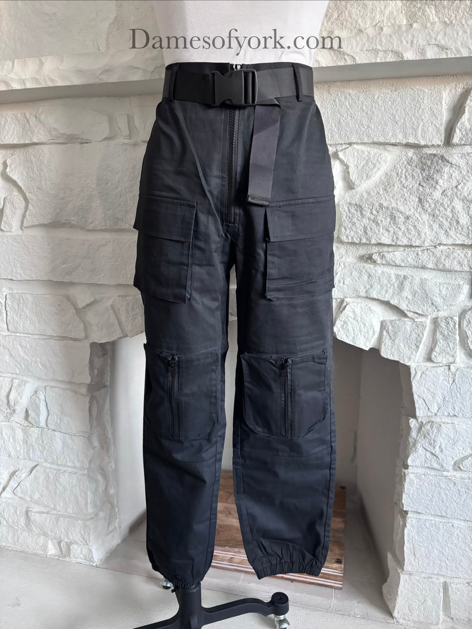 Close-up detail of the Utility Lock Cargo Pants featuring the click buckle belt and cargo pocket design.