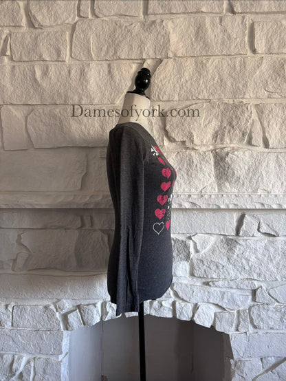 Side view of soft grey graphic long sleeve t-shirt on mannequin.