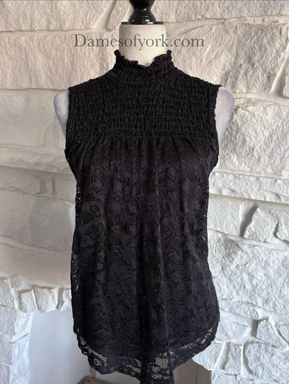 Close-up detail of the Nocturne Lace Blouse featuring the lace overlay and frilled high neckline.