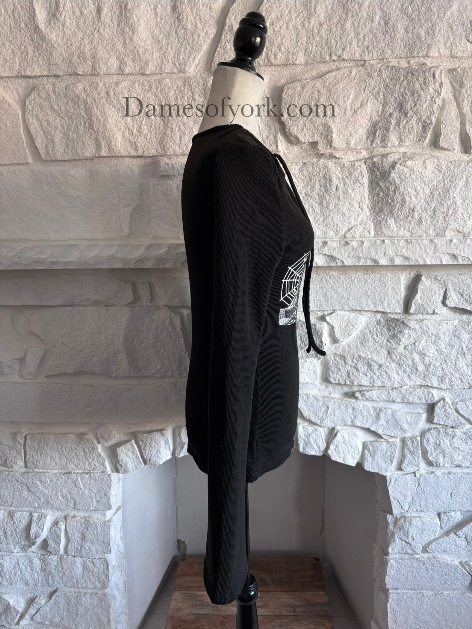 Side view of the Webbed Phantom Sweatshirt highlighting the dramatic flared sleeves and soft knit fabric.