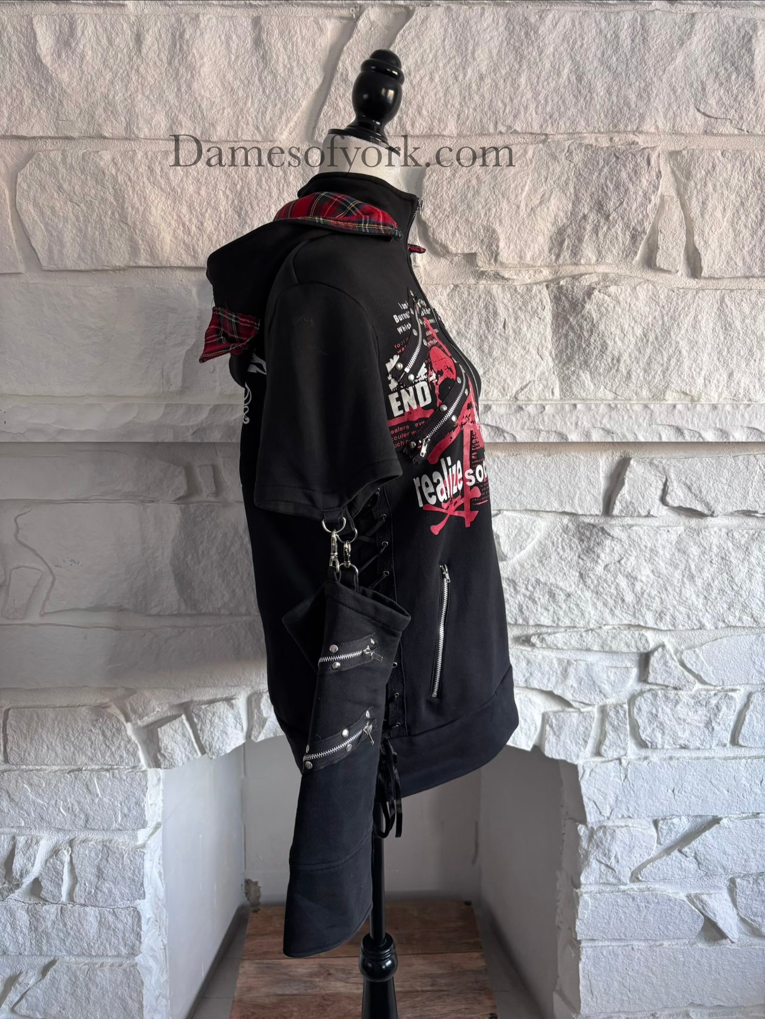 Side view of the Stray Voltage Hoodie highlighting the decorative side lacing and detachable sleeve extensions.