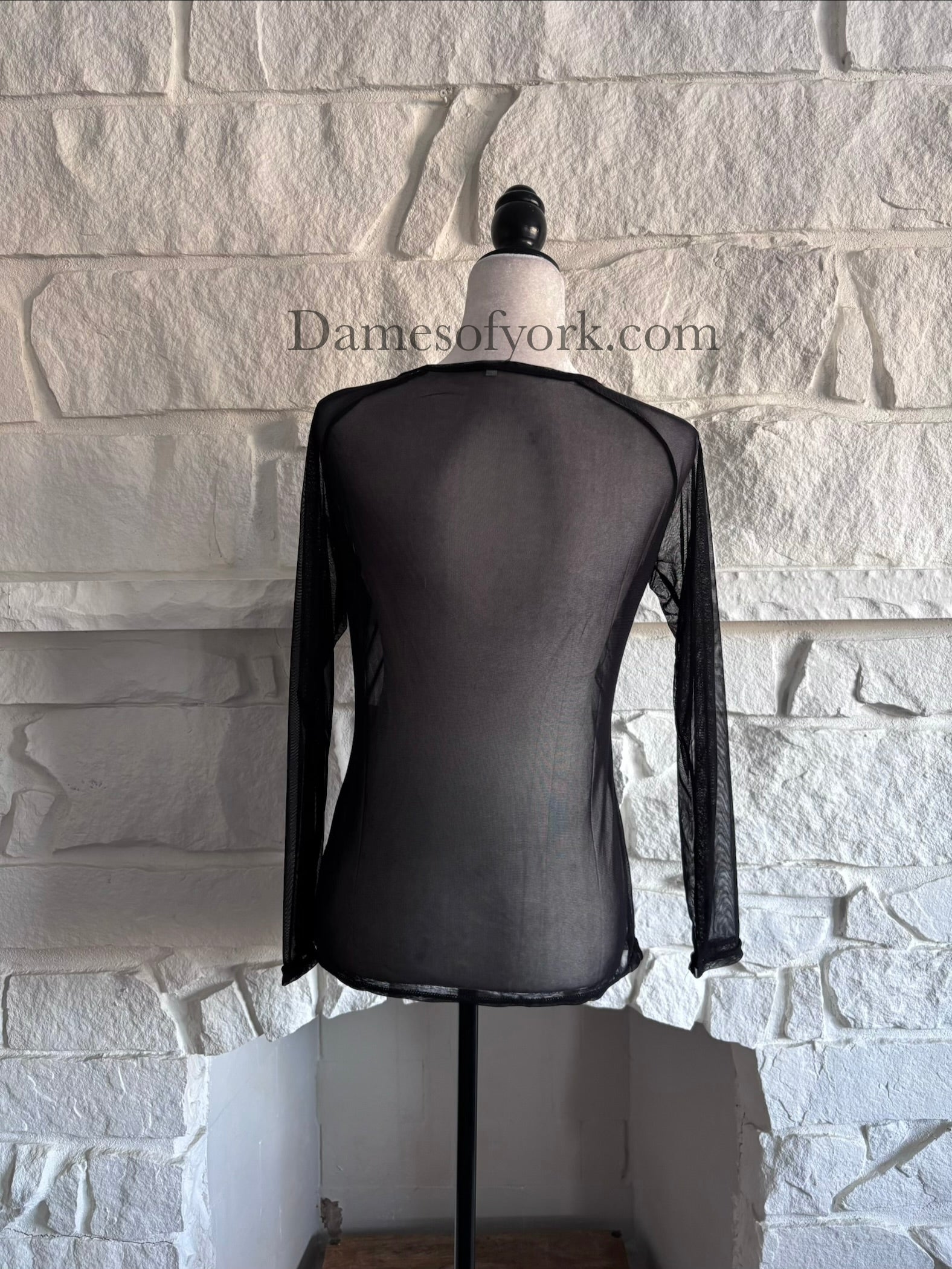 Back view of the Fine Mesh Layering Top showing the lightweight black fine mesh material.