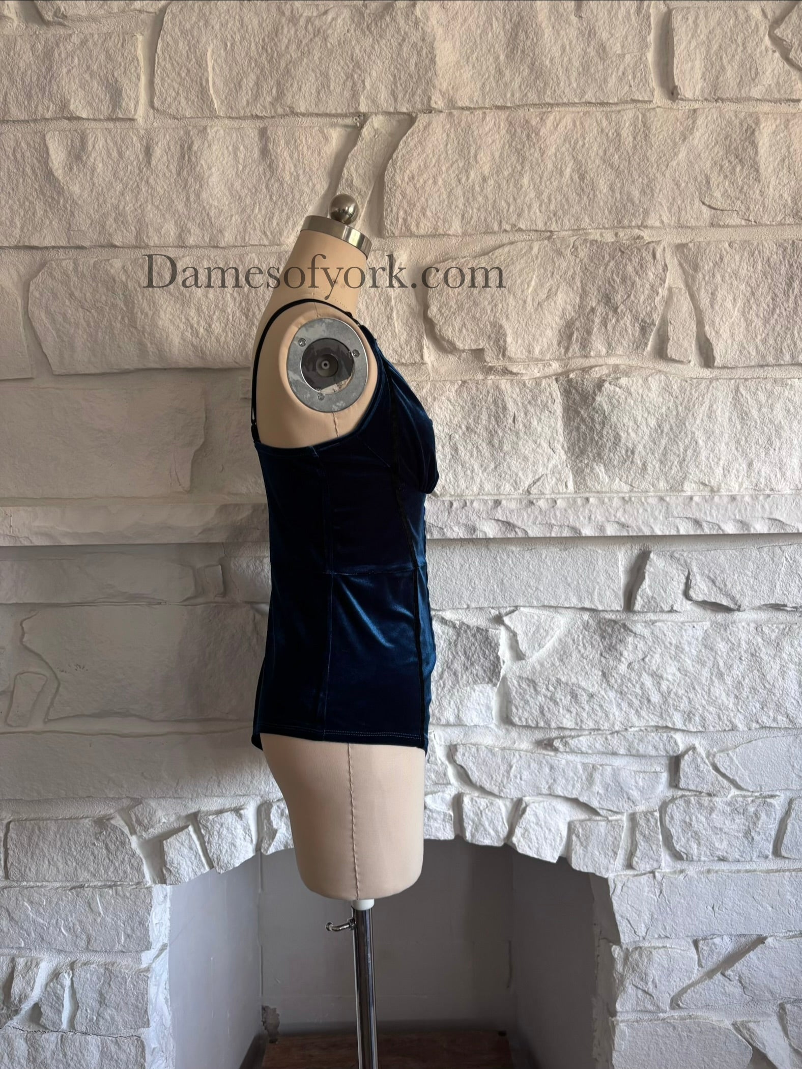 Side view of blue velvet gothic bodysuit on mannequin with adjustable or removable straps