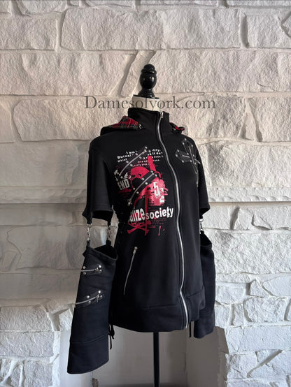 Angled view of the Stray Voltage Hoodie showing the plaid cat ear hood and layered punk zipper accents.