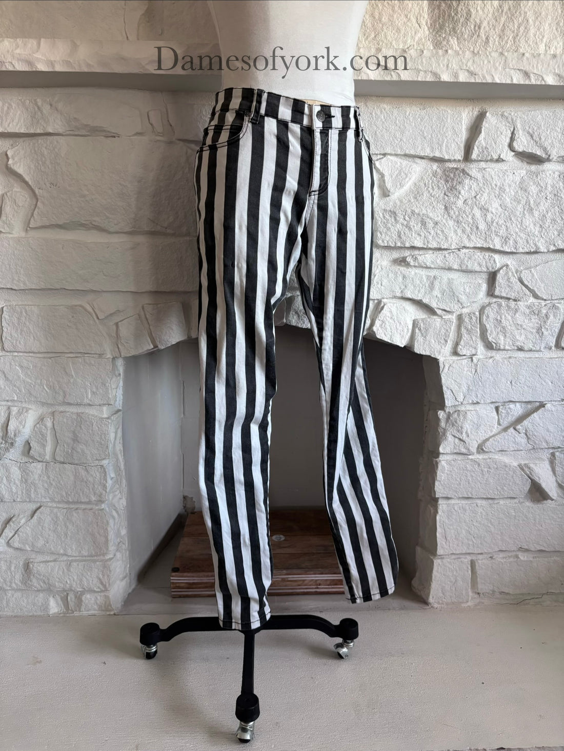 Diagonal view of striped alternative skinny jeans on mannequin showing fitted silhouette