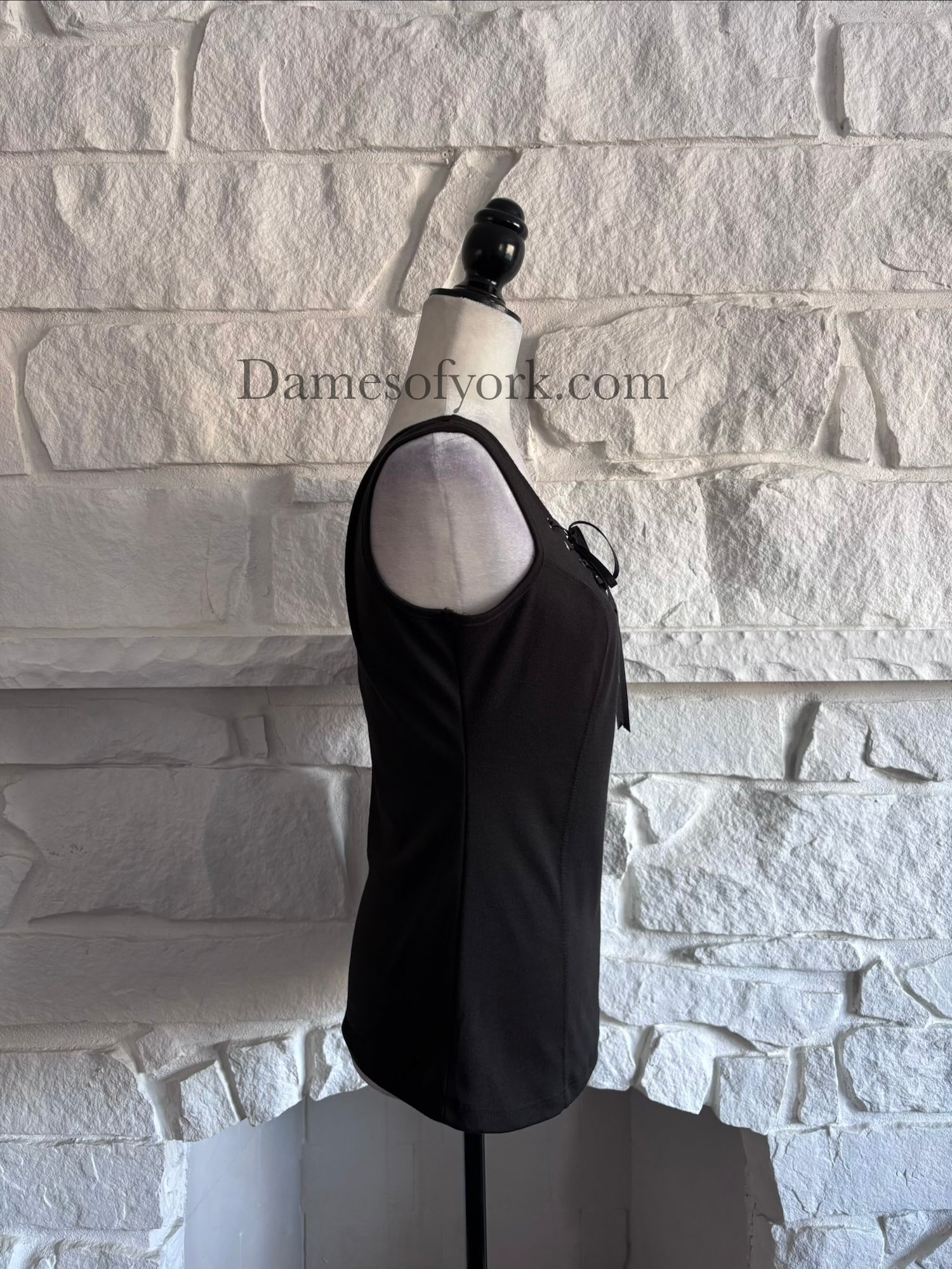 Side view of the Knightfall Lace Up Tank highlighting the sleek tank cut and soft stretch fabric.