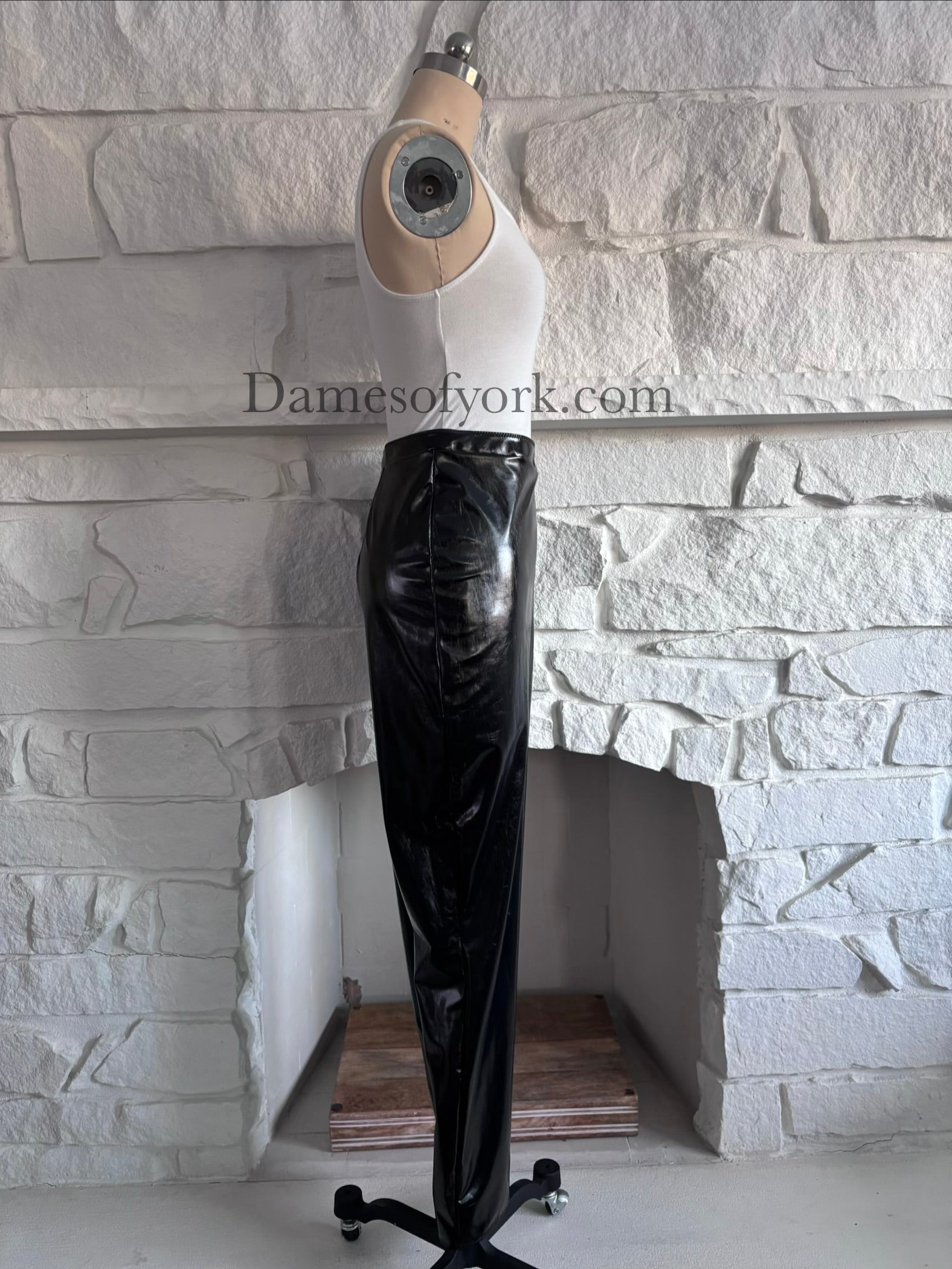 Side view of the Glossy PVC Leggings highlighting the high-shine black PVC fabric.