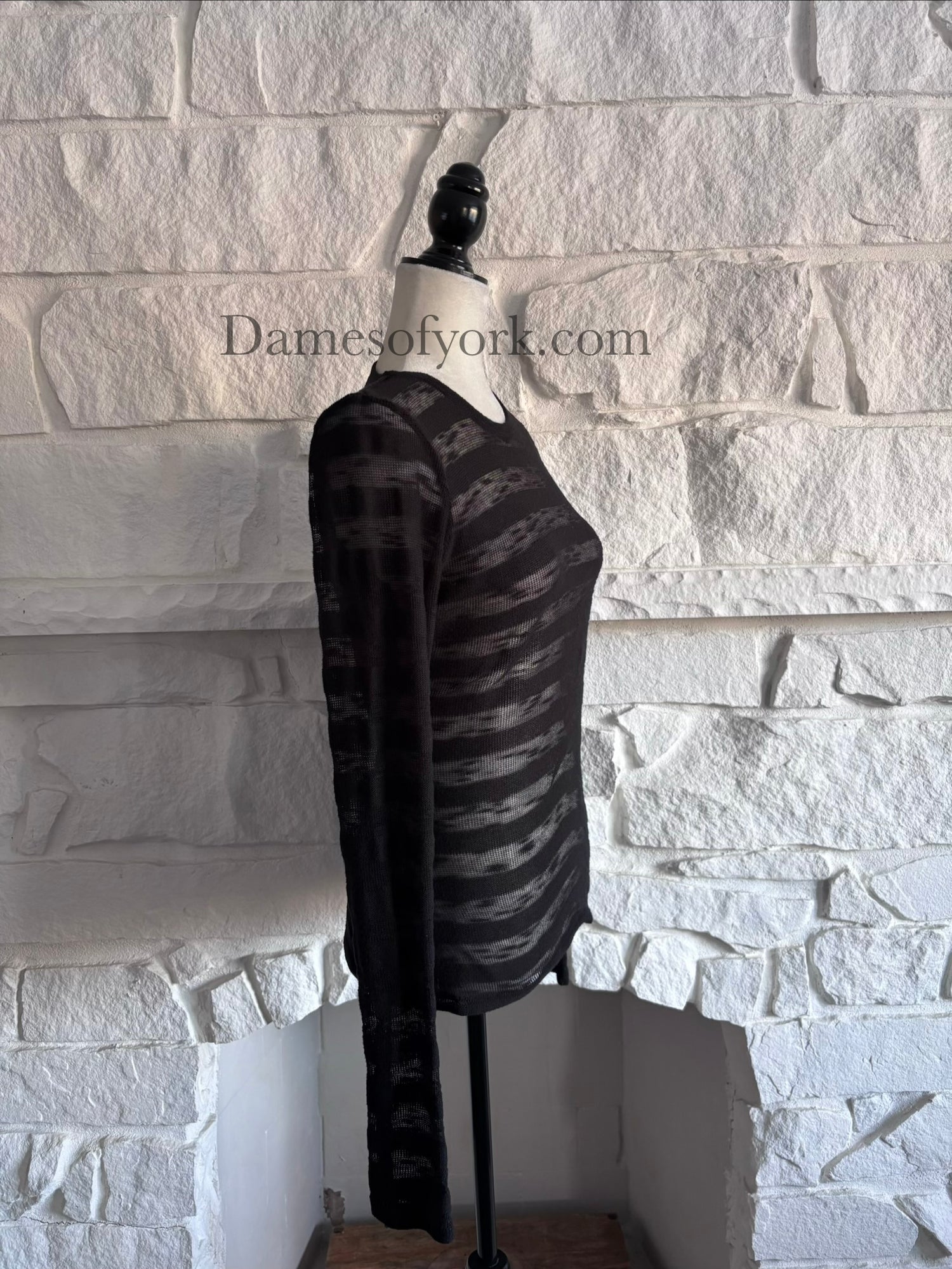 Side view of the Broken Hart Striation Shirt highlighting the soft knit fabric and sheer stripe detailing.