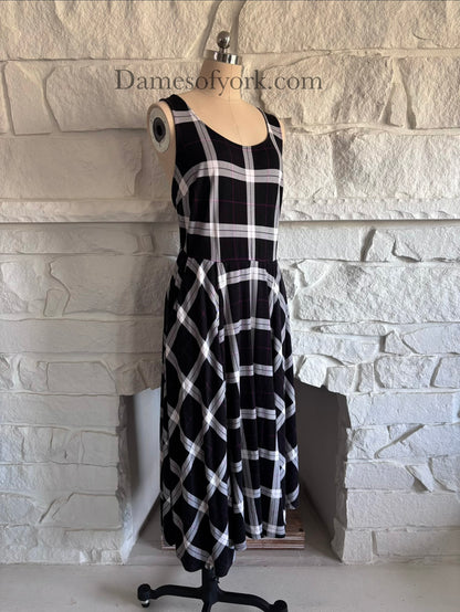 Diagonal view of soft stretchy plaid dress on mannequin showing skater silhouette