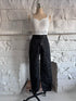 Front view of the Utility Lock Cargo Pants, black cargo pants with four large front pockets and a built-in belt with a click buckle.