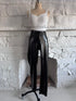 Front view of the Glossy PVC Leggings, shiny black PVC leggings with a sleek fitted silhouette.