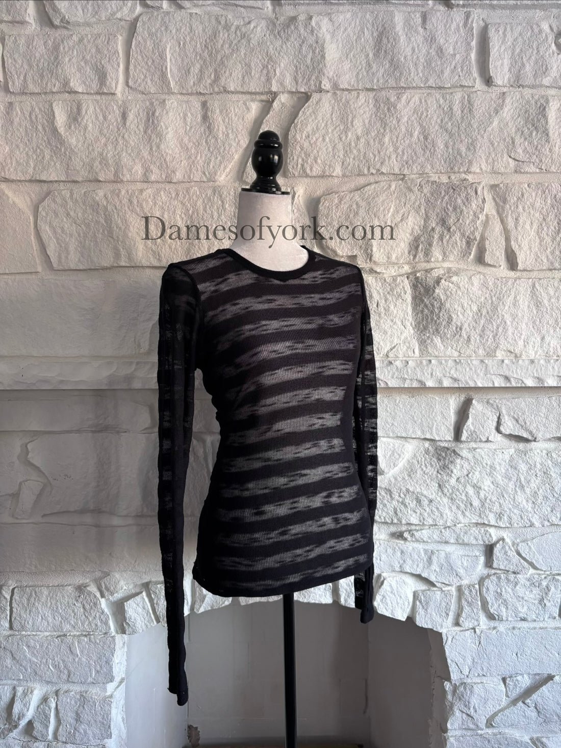 Angled view of the Broken Hart Striation Shirt showing the semi-sheer horizontal stripe pattern and fitted silhouette.