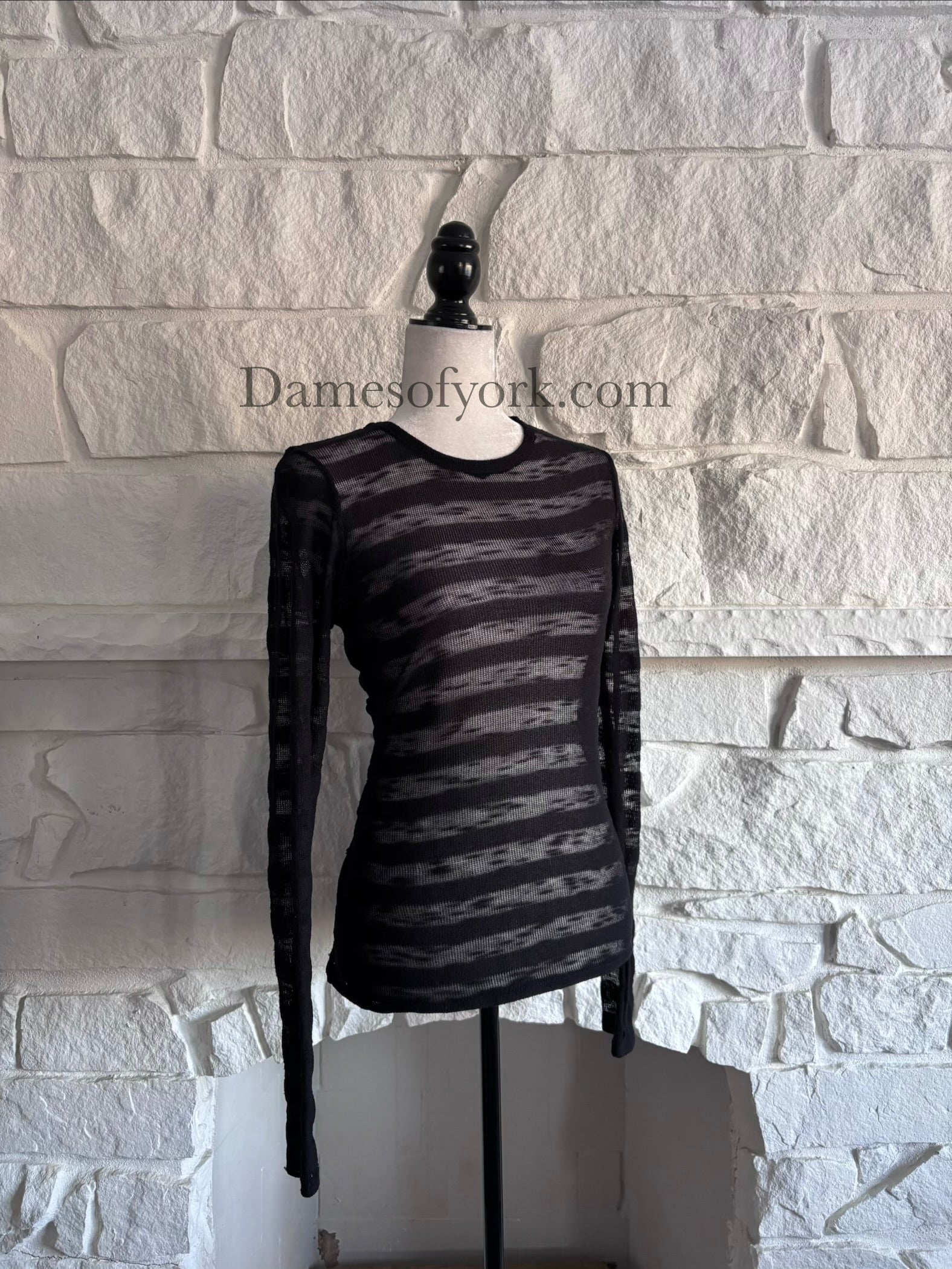 Angled view of the Broken Hart Striation Shirt showing the semi-sheer horizontal stripe pattern and fitted silhouette.