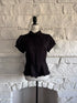 Front view of black peplum button-up blouse on mannequin with Peter Pan collar