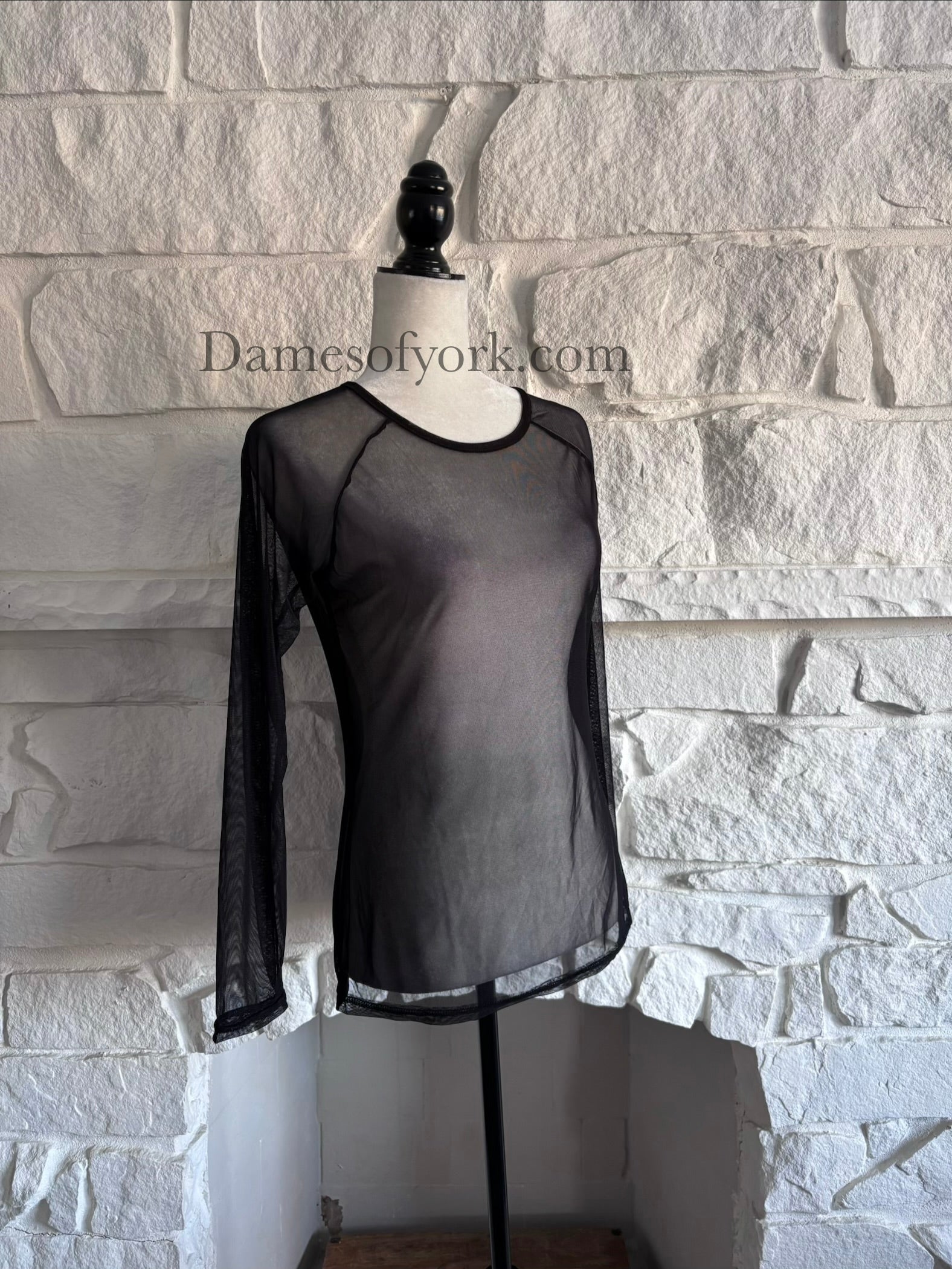 Angled view of the Fine Mesh Layering Top showing the fine mesh texture and fitted silhouette.