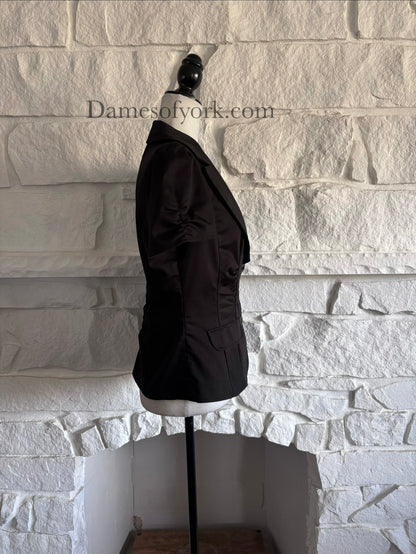 Side view of ruched black blazer on mannequin with fitted waist silhouette