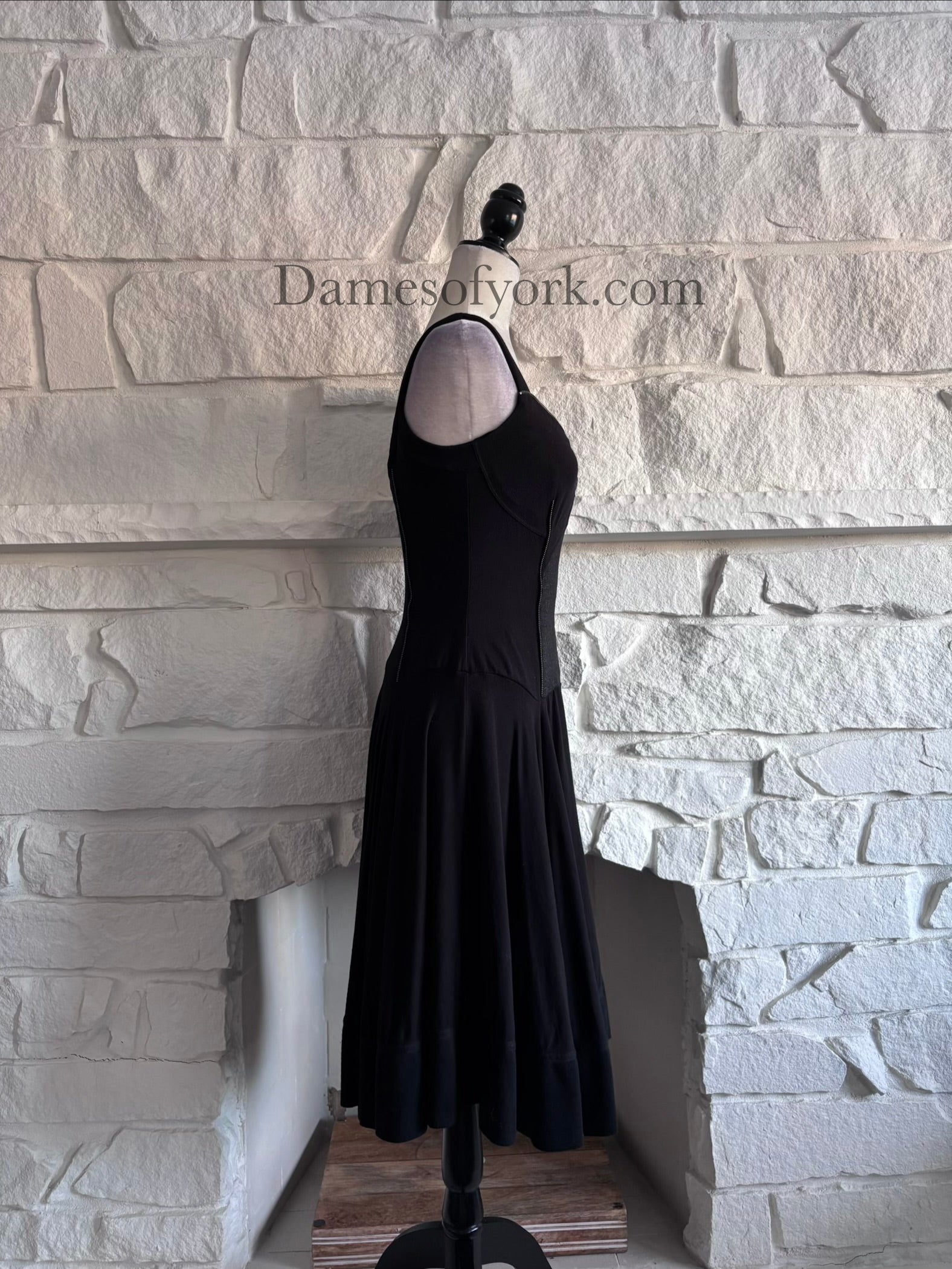 Side view of the Ironheart Zipper Dress highlighting the fitted bodice and flared skirt silhouette.