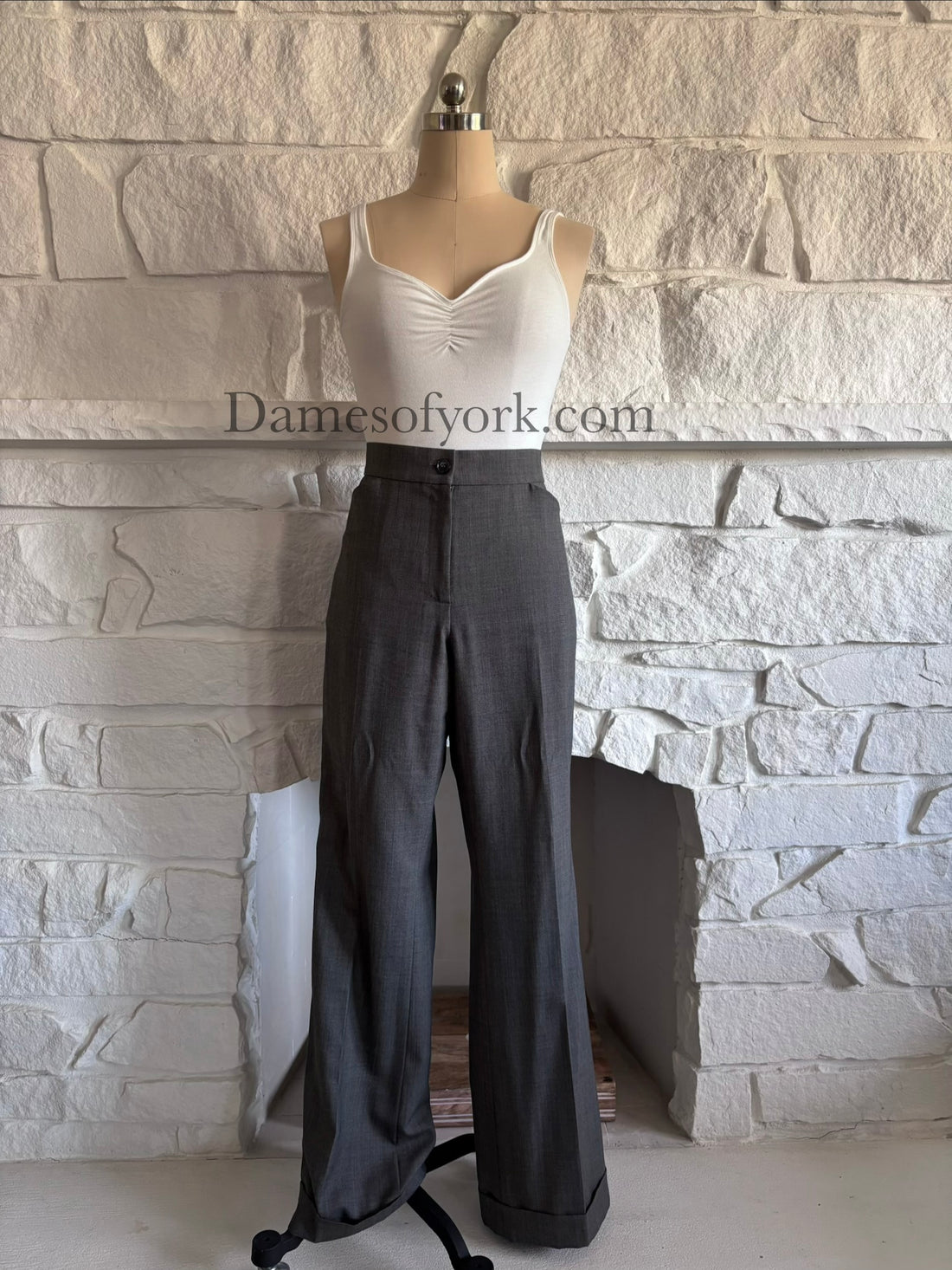 Front view of grey straight leg dress trousers on mannequin with tailored fit