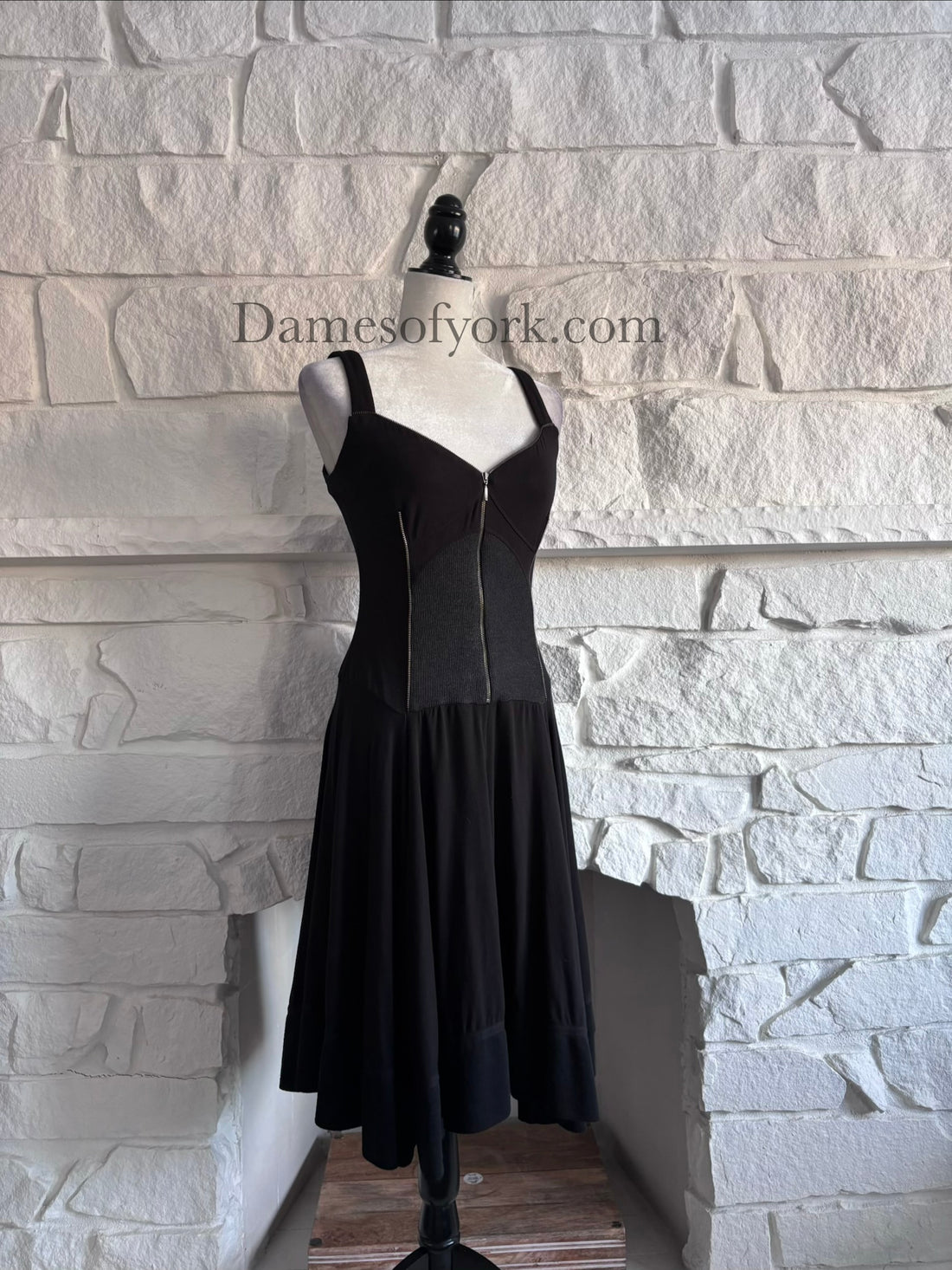 Angled view of the Ironheart Zipper Dress showing the flared skirt and structured zipper design.