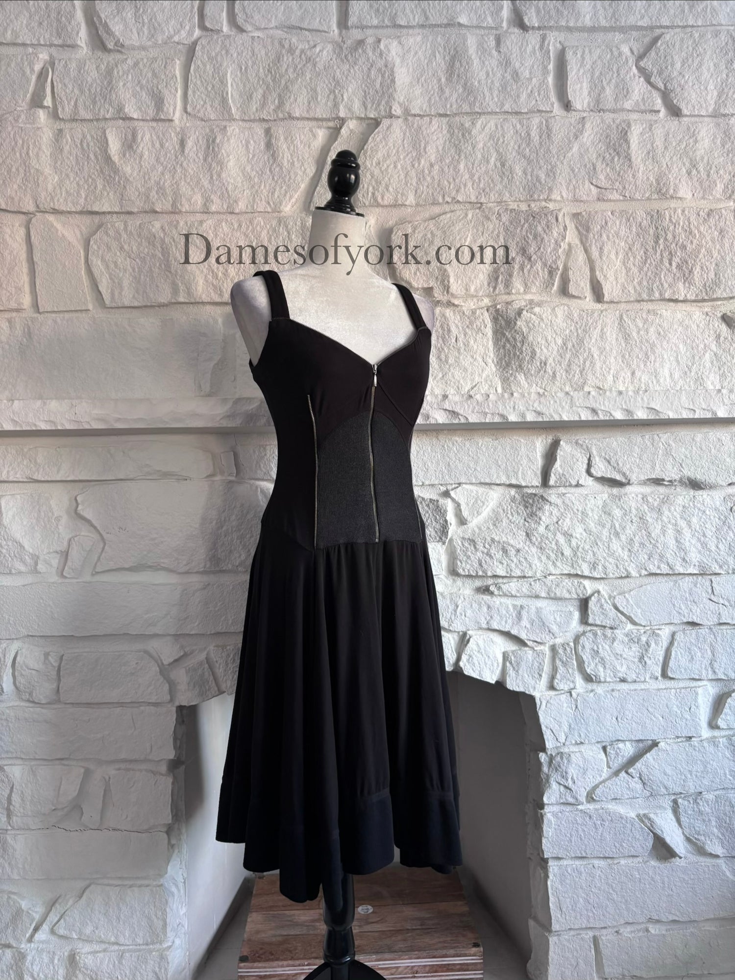 Angled view of the Ironheart Zipper Dress showing the flared skirt and structured zipper design.