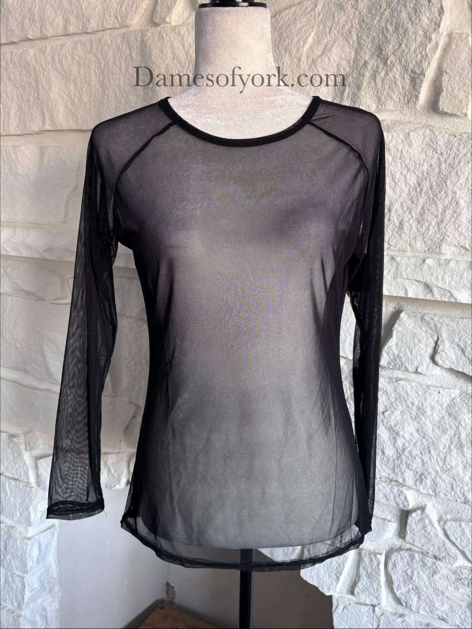 Close-up detail of the Fine Mesh Layering Top featuring the fine mesh fabric with small mesh holes.