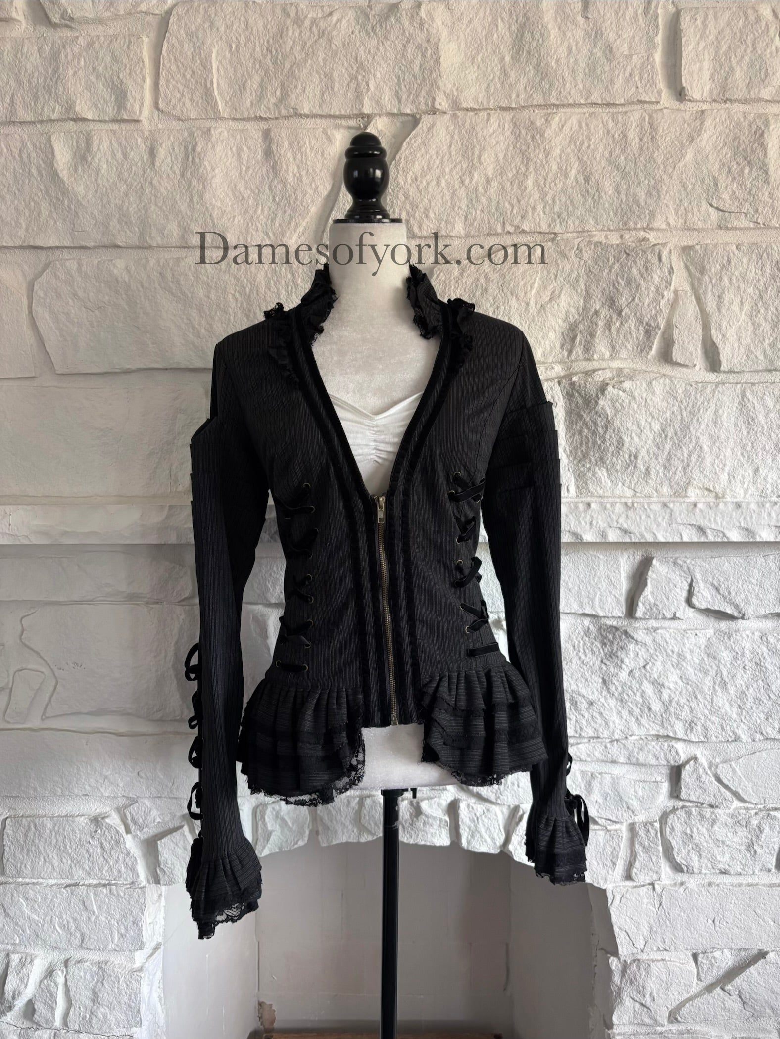 Front view of grey striped gothic jacket on mannequin with lace ruffle collar and zip closure