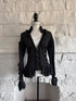 Front view of grey striped gothic jacket on mannequin with lace ruffle collar and zip closure