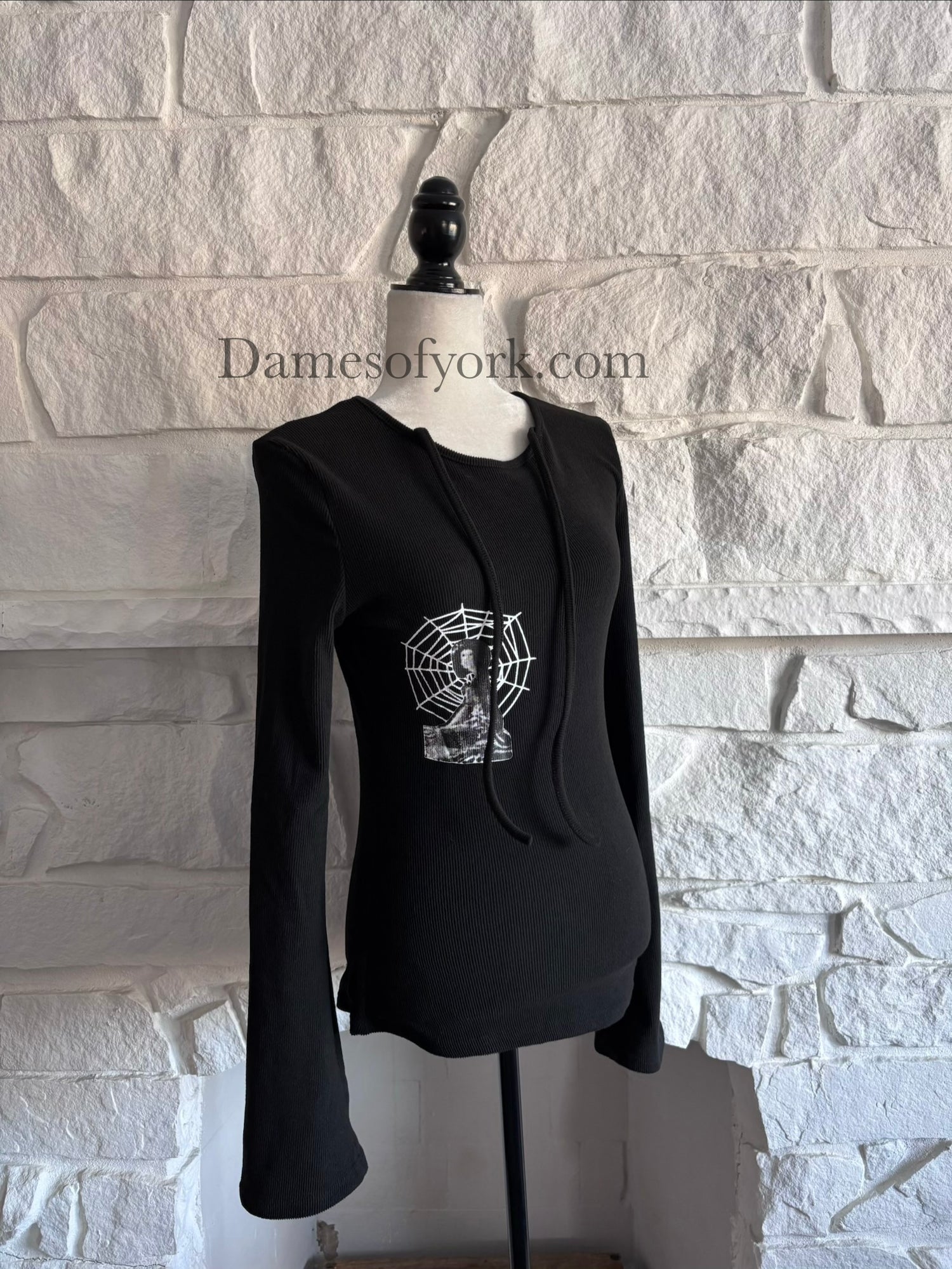 Angled view of the Webbed Phantom Sweatshirt showing the spiderweb graphic and flared sleeve silhouette.