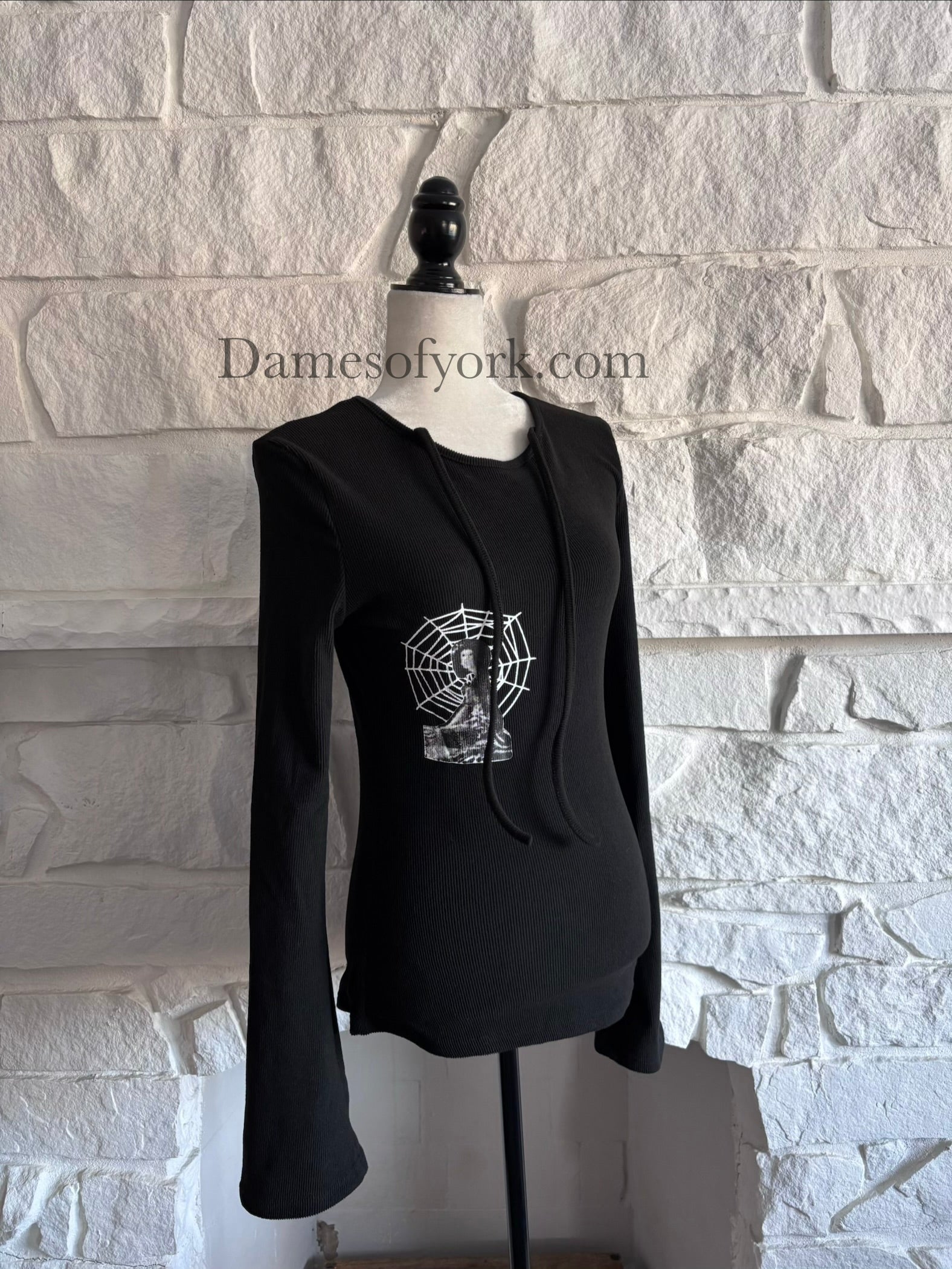 Angled view of the Webbed Phantom Sweatshirt showing the spiderweb graphic and flared sleeve silhouette.