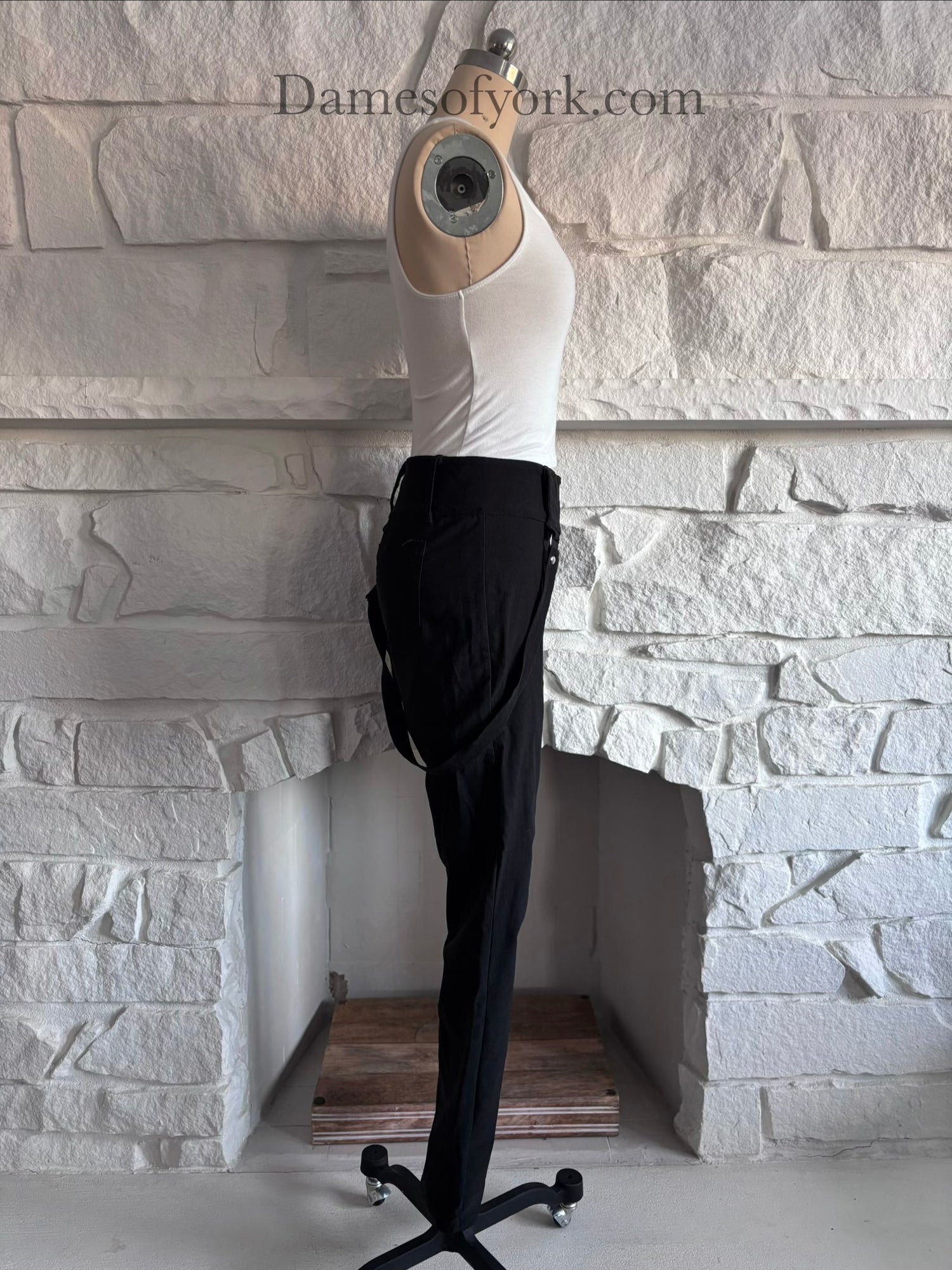 Side view of the Strapline Suspender Pants highlighting the stretch fabric and suspender design.