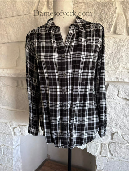 Close-up view of black and white plaid button-up shirt showing the plaid pattern in detail