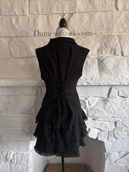 Back view of black gothic vest on mannequin with adjustable lace-up back