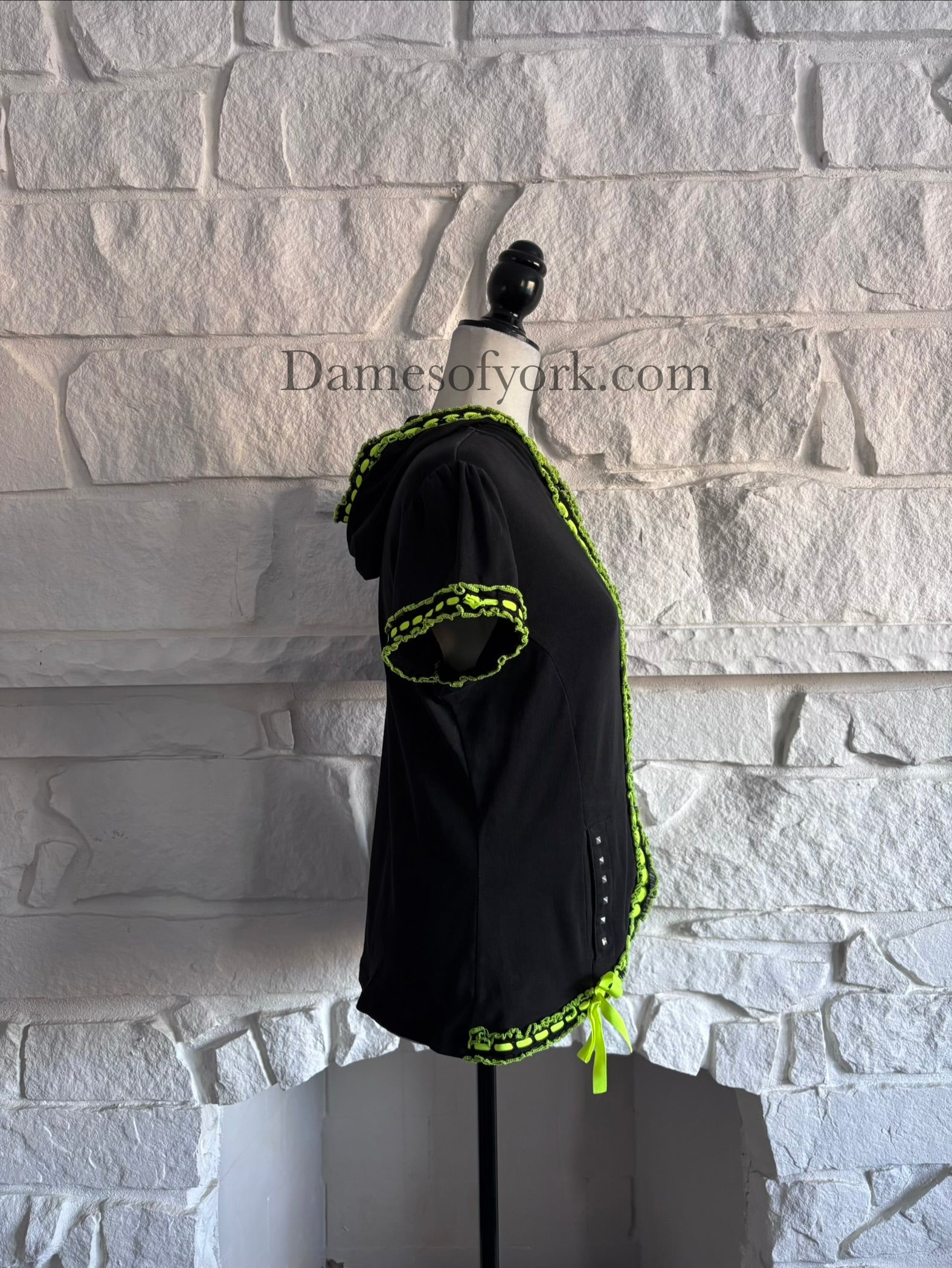 Side view of the Neon Pulse Hoodie highlighting the neon trim along the hem and sleeve cuffs.