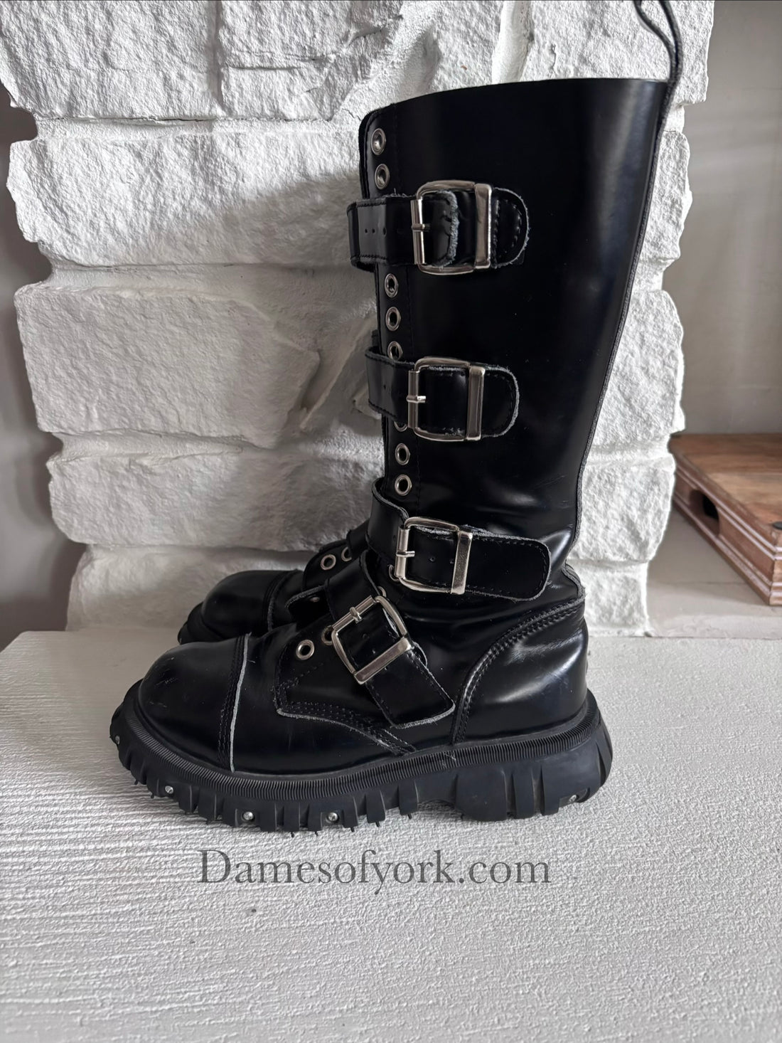 Left side view of the Rivet Command Boots highlighting the thick screw-detailed sole and mid-calf height.