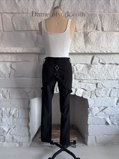 Back view of the Strapline Suspender Pants showing the fitted black pants design and suspenders.
