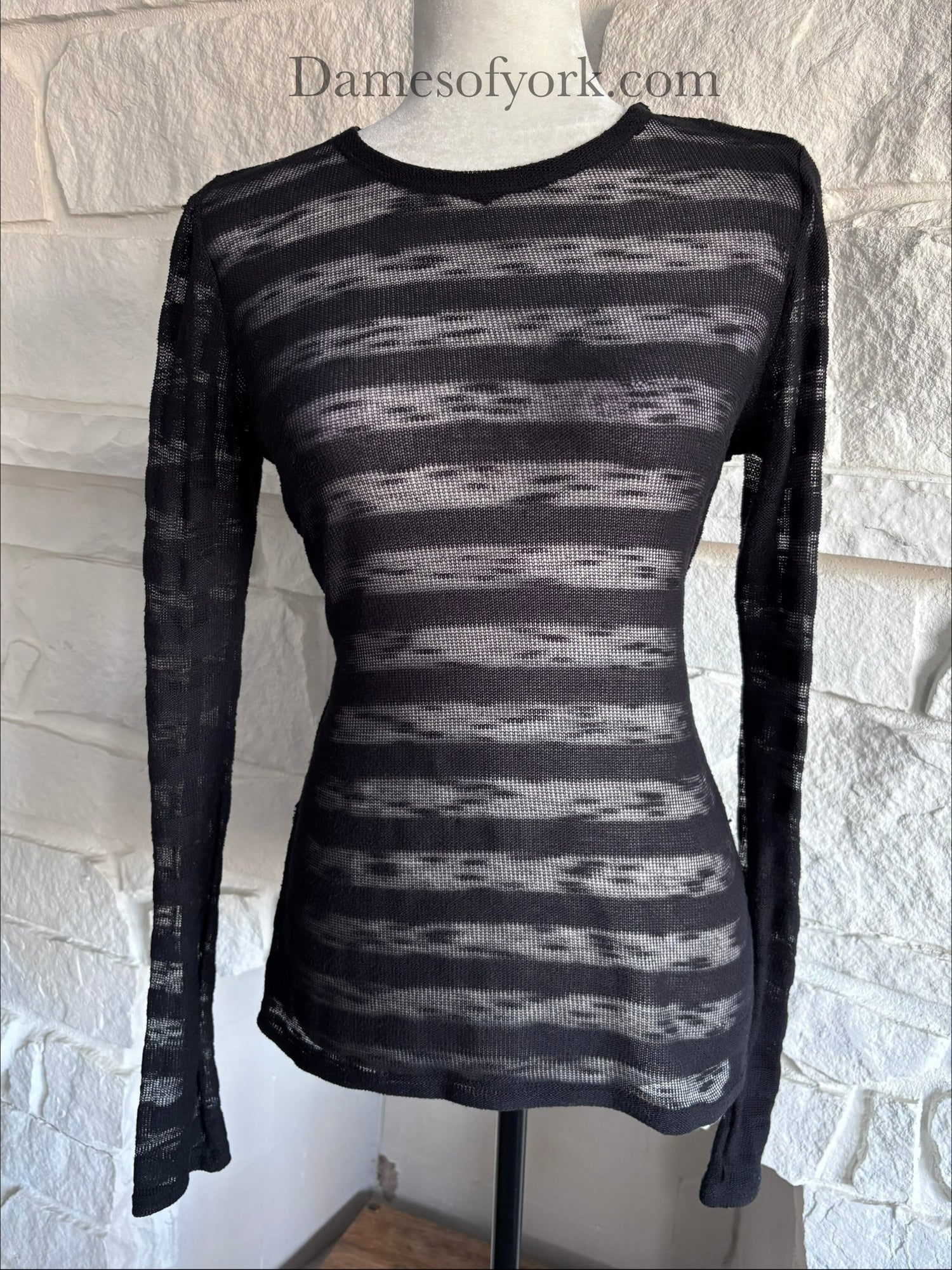 Close-up detail of the Broken Hart Striation Shirt featuring the alternating sheer and solid black stripe fabric.