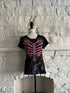 Front view of a black gothic graphic t-shirt featuring a pink ribcage shaped like a heart with printed lace-up detail and a subtle grey skeleton design underneath, styled in an emo-inspired alternative design.